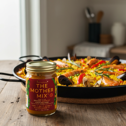 Simrancooks The Mother Mix Spanish sofrito with seafood for paella, showcasing vibrant ingredients and fresh seafood in a pan.