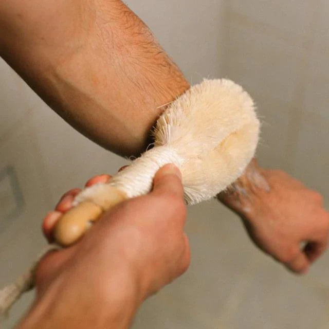 Pretty Farm Girl sisal exfoliating dry brush for skin exfoliation, featuring natural sisal bristles and a wooden handle accessory.
