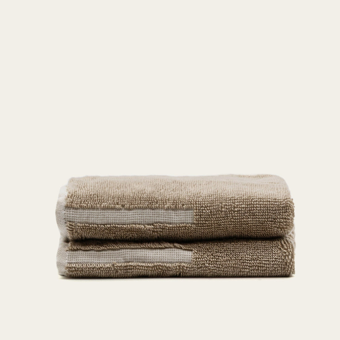 Close-up of Sorrel Australian cotton towel by Italic showing soft, textured fabric with neutral color for luxurious bathroom use.