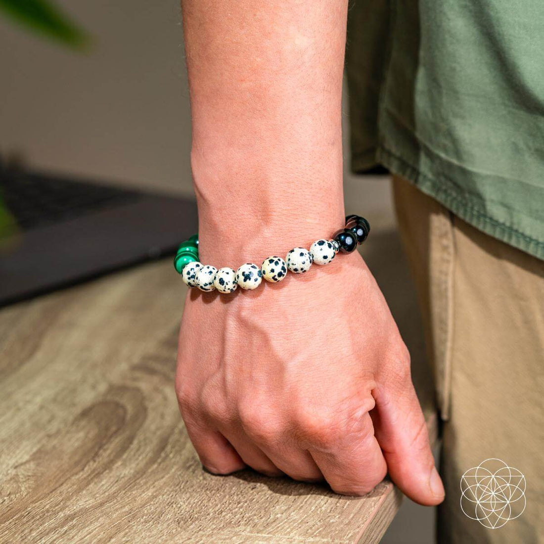Dalmatian Jasper healing bracelet by Conscious Items featuring black and white spotted stones on an elastic band.