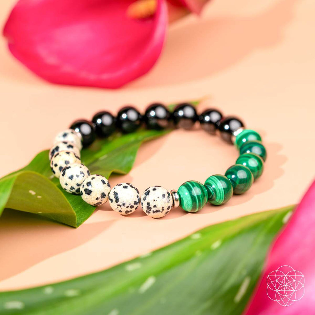 Dalmatian Jasper healing bracelet from Conscious Items with black and white spotted stones, designed for grounding and balance.