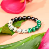 Dalmatian Jasper healing bracelet from Conscious Items with black and white spotted stones, designed for grounding and balance.