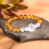 Golden bracelet with spark Hope charm from Conscious Items, symbolizing new beginnings and positive energy.