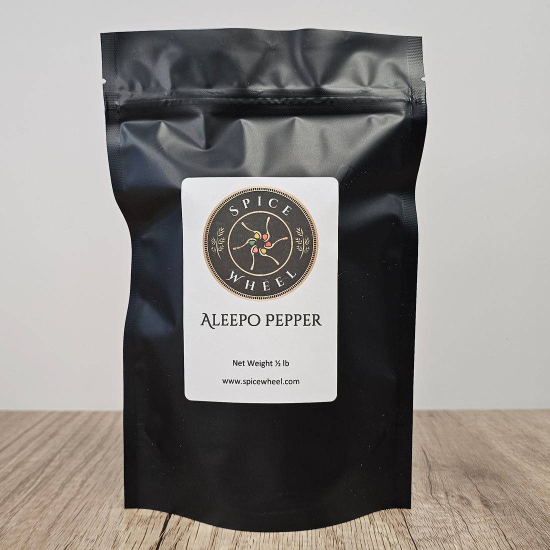 A 1/2 pound Aleepo pepper from Spice Wheel, a versatile bulk spice in a clear plastic bag with a label.