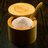 Bamboo salt container filled with pink Himalayan salt, Spice Wheel storage container for kitchen spices and salts.