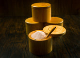 Bamboo salt container filled with pink Himalayan salt, Spice Wheel container for kitchen storage and spice organization.