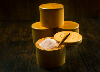 Bamboo salt container filled with pink Himalayan salt, Spice Wheel container for kitchen storage and spice organization.