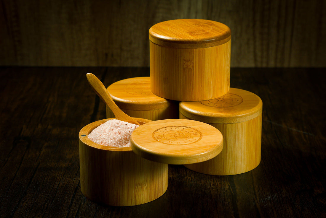 Bamboo salt container filled with pink Himalayan salt, Spice Wheel storage jar for kitchen spices and salt.
