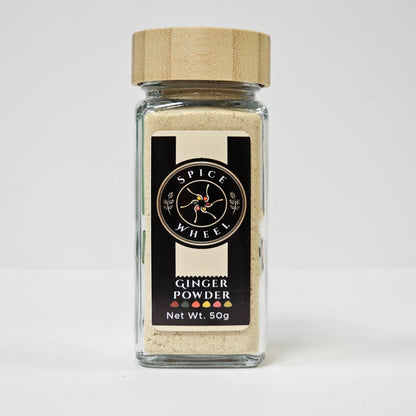 Fine ginger powder from Spice Wheel, showcasing a close-up of the aromatic, freshly ground ginger spice in a glass jar.