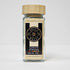Fine ginger powder from Spice Wheel, showcasing a close-up of the aromatic, freshly ground ginger spice in a glass jar.