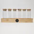 Clear glass storage tubes from Spice Wheel collection, ideal for organizing spices or small items in a sleek, transparent design.