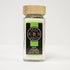 Bright lime sugar from Spice Wheel, showing a jar of vibrant green lime-flavored sugar crystals on a wooden surface.