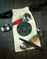 Set of Spice Wheel magnetic spoons with leveler and canvas gift bag, ideal for precise spice measuring and storage.