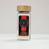 Glass jar of apple sugar from Spice Wheel with a clear label and a metal lid, containing sweet apple-flavored sugar in a compact container.