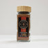 Glass jar of Spice Wheel cinnamon sugar with a clear view of the label and cinnamon sugar inside.