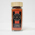 Glass jar of Hungarian paprika spice from Spice Wheel, showing vibrant red powder inside a clear container.