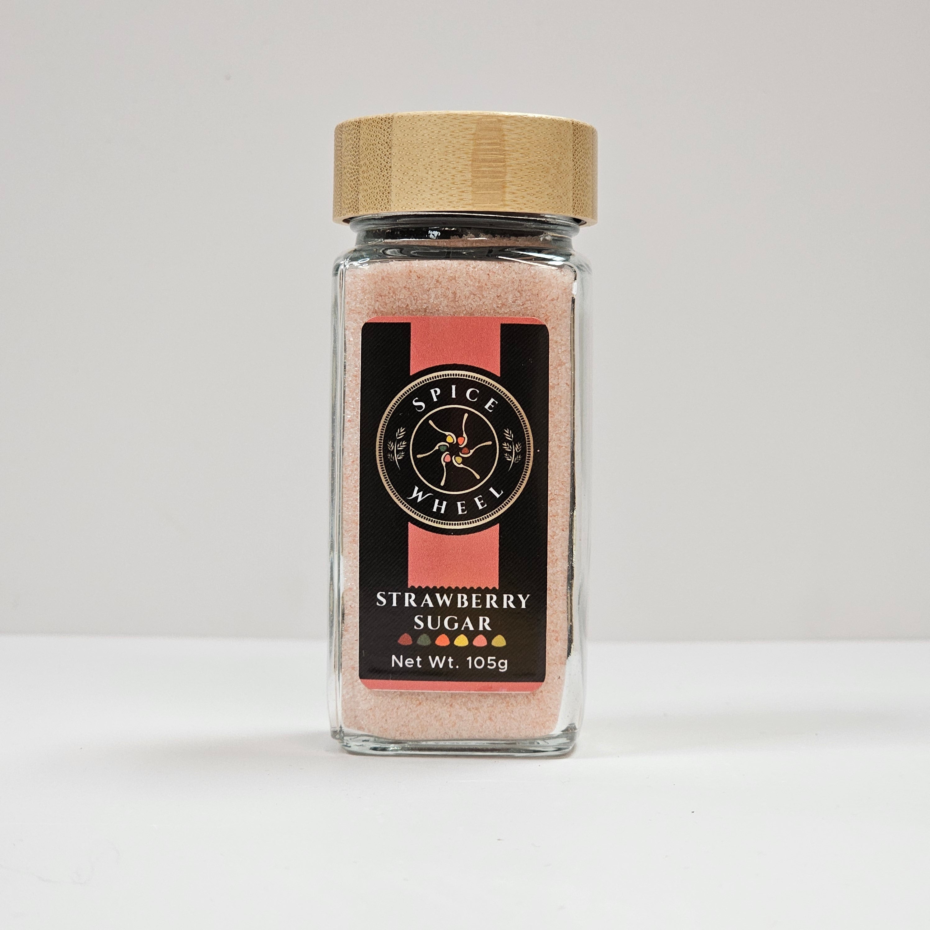 Glass jar of strawberry sugar from Spice Wheel, showcasing the vibrant, sweet strawberry sugar inside the clear container.