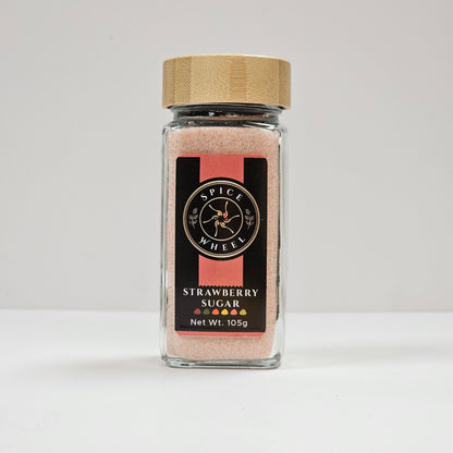 Glass jar of strawberry sugar from Spice Wheel, showcasing the vibrant, sweet strawberry sugar inside the clear container.