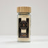 Glass jar of vanilla sugar by Spice Wheel, showing the clear container filled with white vanilla sugar crystals.
