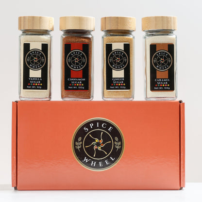 Spice Wheel Cozy Sugar Gift Set with vanilla, cinnamon, ginger, and caramel spices in a colorful 4-pack.