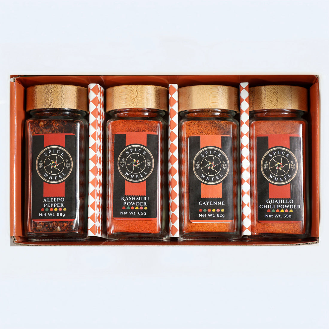 Fiery Four Spice Wheel gift set with four colorful chili peppers representing global hot spices in a spice collection.