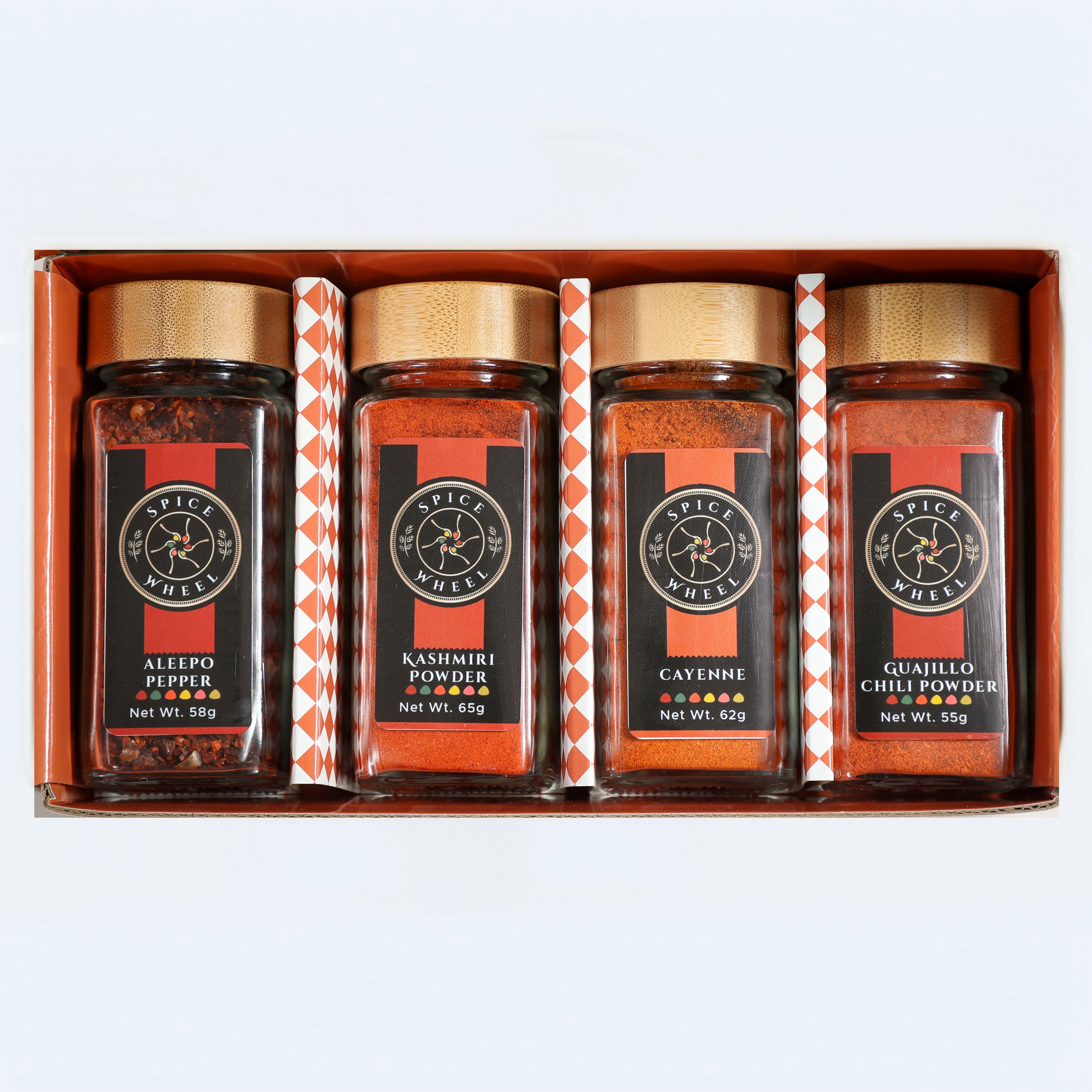 Fiery Four Spice Wheel gift set with four colorful chili peppers representing global hot spices in a spice collection.