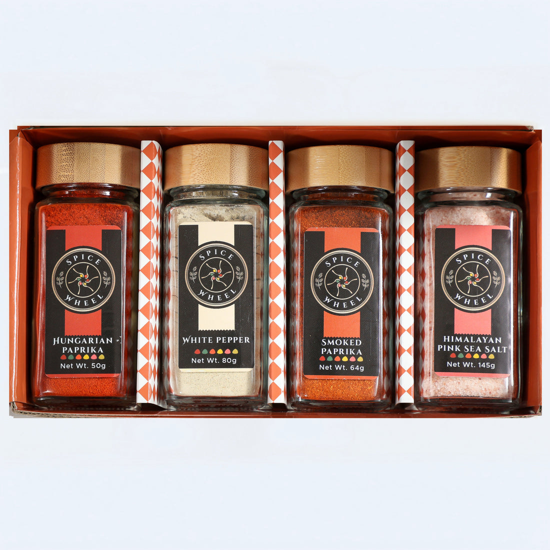 Spice Wheel Foundations of Flavor gift set featuring four essential spices, with a focus on vibrant paprika in a spice 4 pack.
