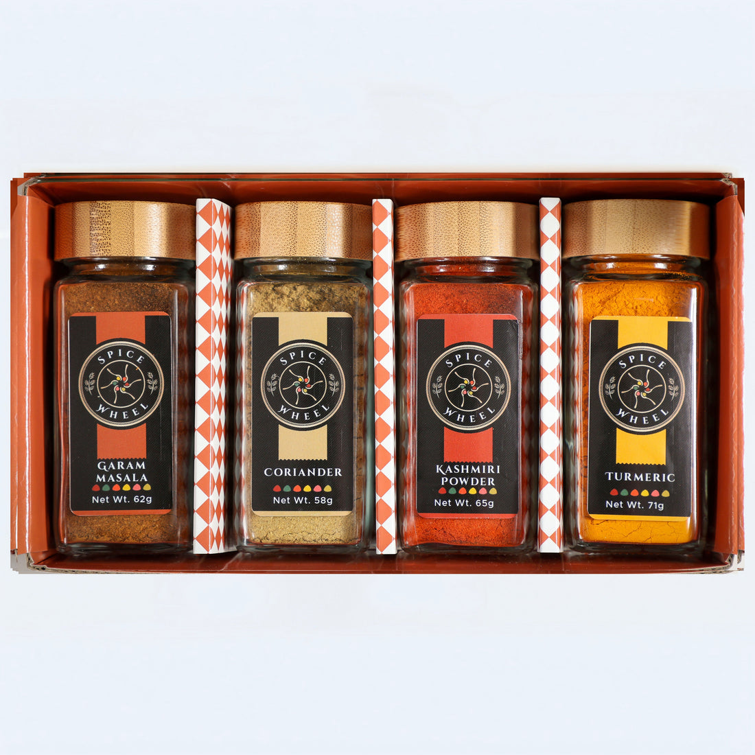 Indian Spice Gift Set by Spice Wheel, includes four spice jars in a starter kit, showcasing vibrant Indian spices in small containers.