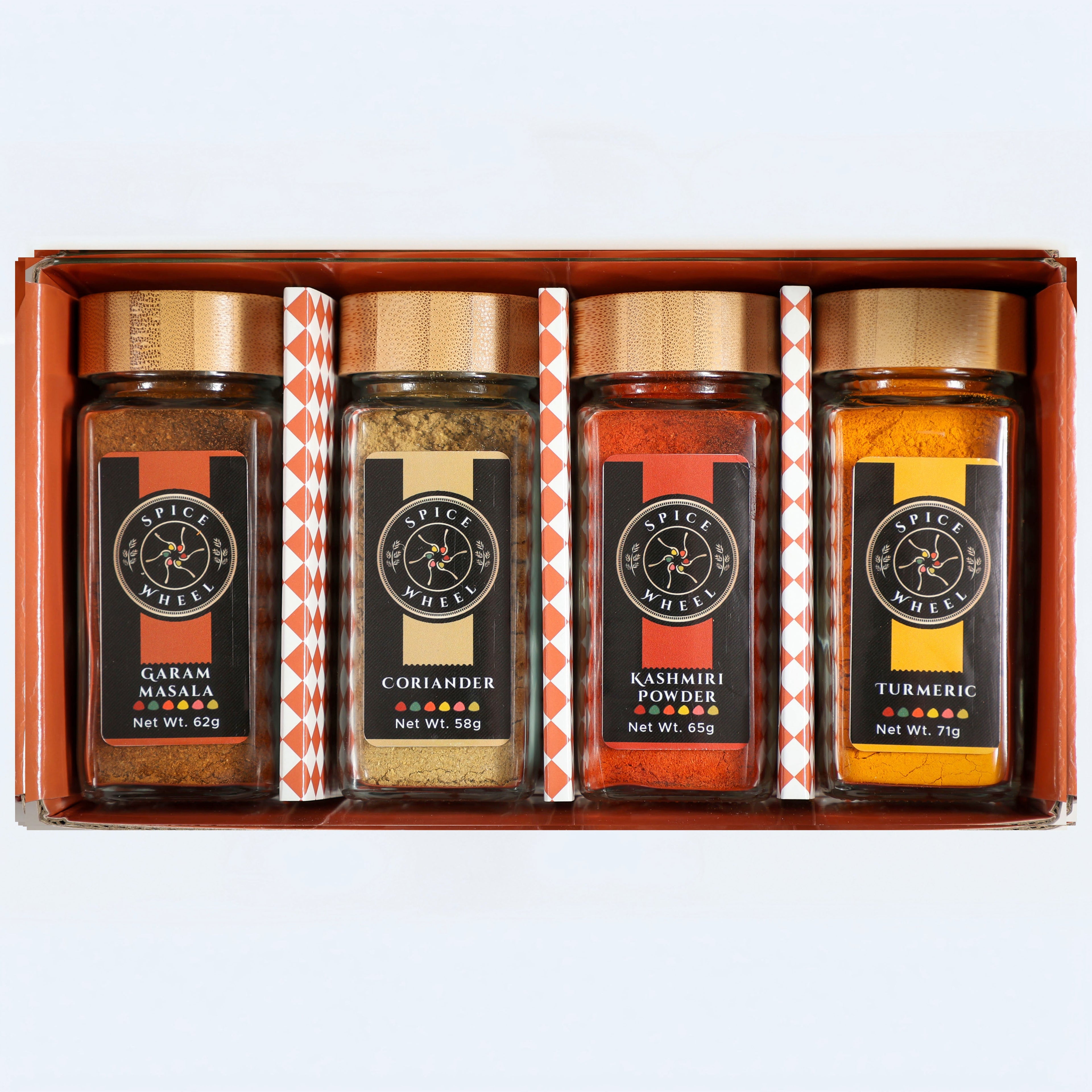 Indian Spice Gift Set by Spice Wheel, includes four spice jars in a starter kit, showcasing vibrant Indian spices in small containers.