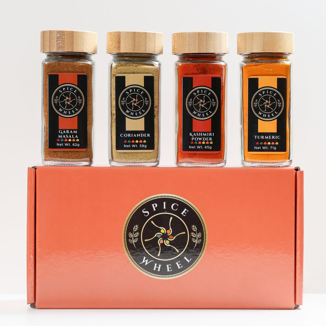 Indian Spice Gift Set with four spice jars from Spice Wheel, featuring colorful packaging and a variety of authentic Indian spices.
