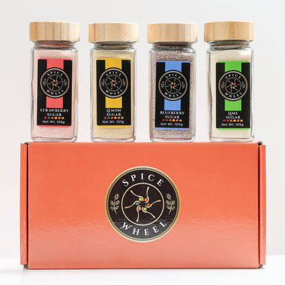 Spice Wheel Mocktail Sugar Gift Set with four flavored sugars in small jars, ideal for tea, baking, mocktails, and cocktails.