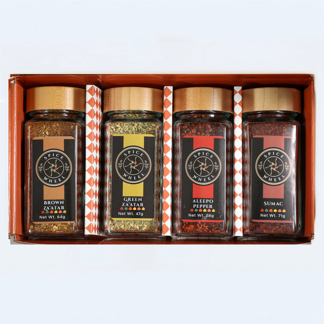 Assorted Mediterranean Spice Essentials Gift Set featuring four Spice Wheel blends, including Zaatar, in colorful jars.