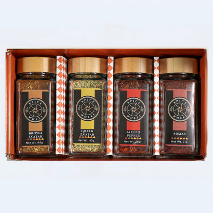 Assorted Mediterranean Spice Essentials Gift Set featuring four Spice Wheel blends, including Zaatar, in colorful jars.