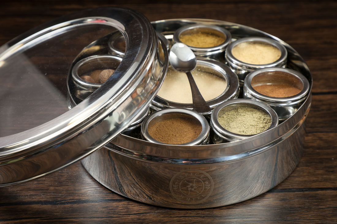 Close-up of a Spice Wheel baking spice wheel with lid, showcasing various baking spices arranged in a circular pattern.