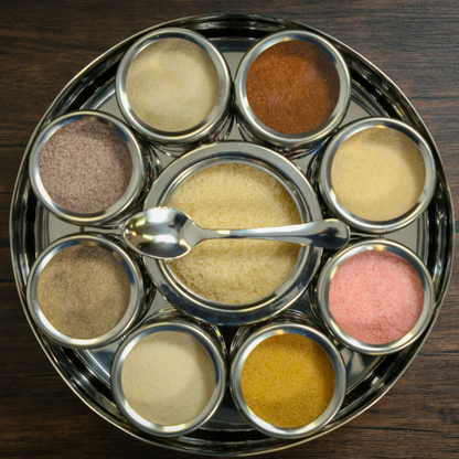 Colorful Spice Wheel with flavored sugar spices on a wooden surface, showcasing various spice segments for baking and cooking.