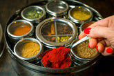 Indian Spice Wheel by Spice Wheel, colorful circular spice display with labeled compartments for various Indian spices.