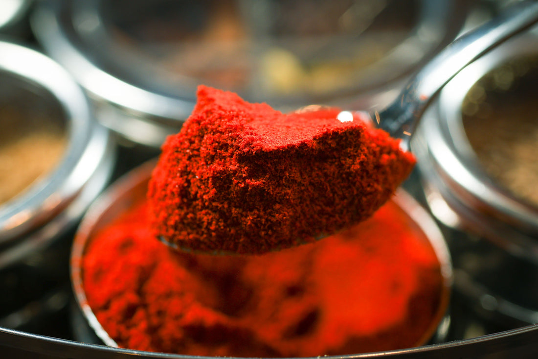 Indian Spice Wheel, a colorful spice wheel with various Indian spices arranged around it, showcasing authentic flavor ingredients.