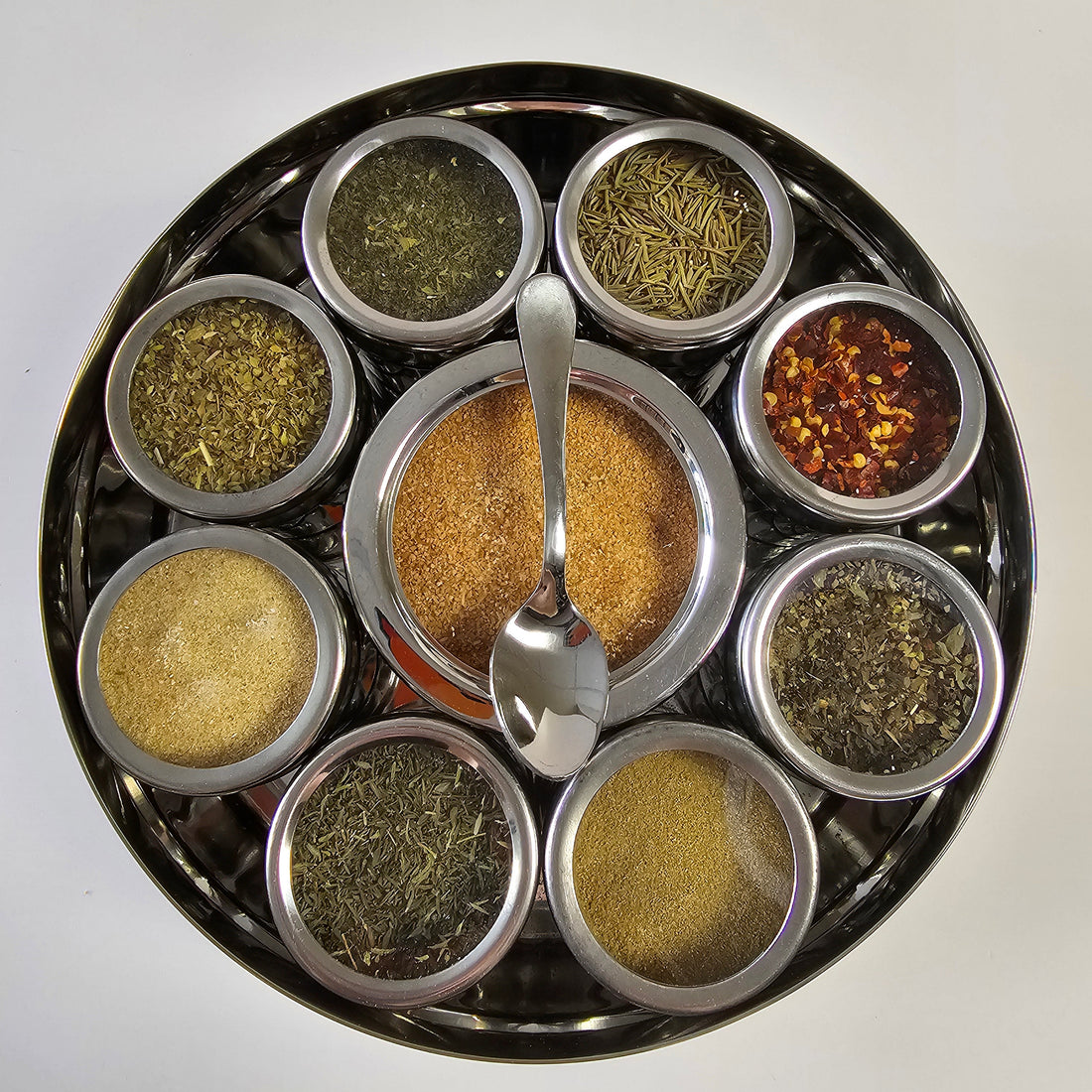 Italian Spice Wheel showing a colorful circular spice rack with various herbs and spices in small jars.