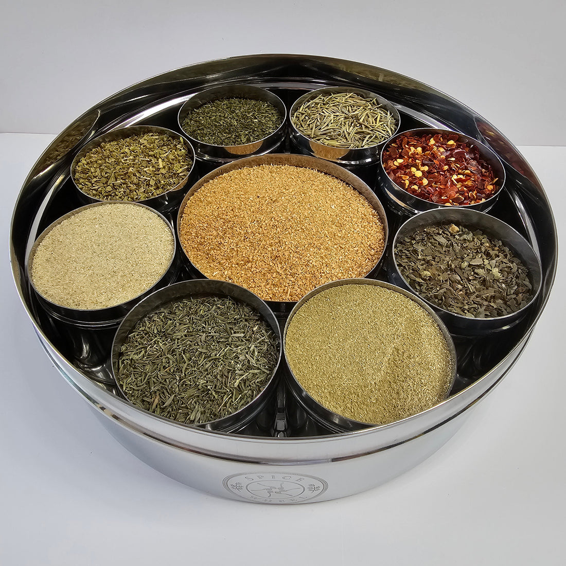 Italian Spice Wheel displaying colorful spices and herbs on a wooden spice wheel for cooking and flavoring dishes.