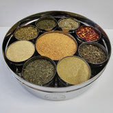 Italian Spice Wheel displaying colorful spices and herbs on a wooden spice wheel for cooking and flavoring dishes.