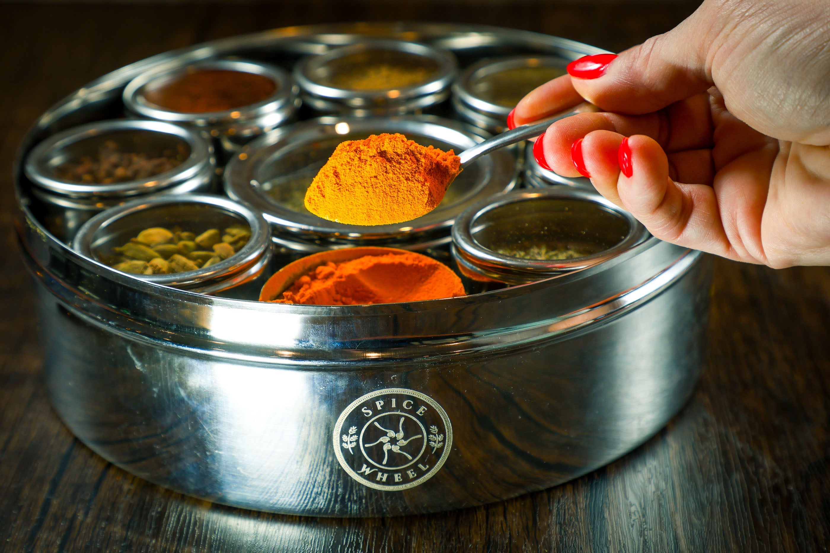 Mediterranean Spice Wheel by Spice Wheel displaying colorful spice sections in a circular chart for culinary use.