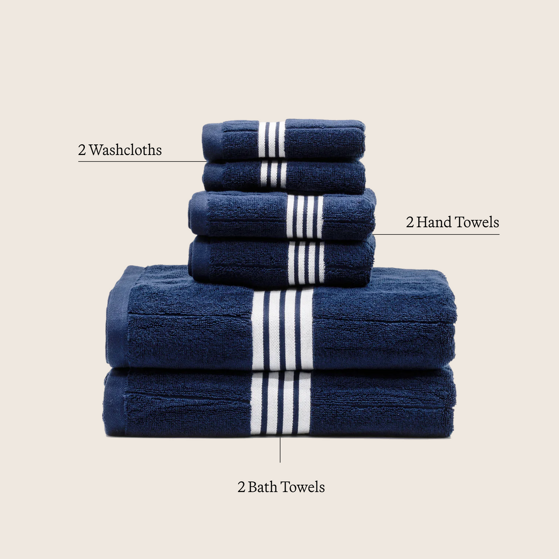 Set of Nautilus Australian Cotton bath towels by Italic, showing soft, plush white towels neatly folded and stacked.