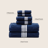 Set of Nautilus Australian Cotton bath towels by Italic, showing soft, plush white towels neatly folded and stacked.