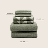 Set of five Deia Australian Cotton Towels by Italic, soft and absorbent home bed towels on a neutral background.