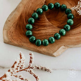 Conscious Items The Anxiety Bracelet featuring calming beads and a silver charm, designed to promote relaxation and mindfulness.