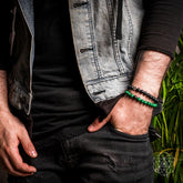 Pair of black and gold bracelets from The Anxiety Double Bracelet Set by Conscious Items, featuring adjustable designs and engraved accents.