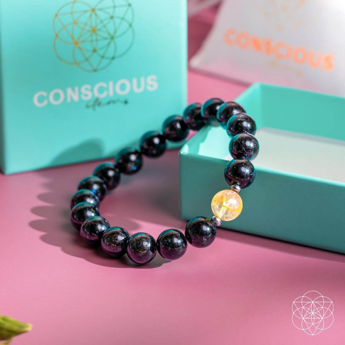 Deep healing bracelet featuring Arfvedsonite stones from Conscious Items, showcasing a sleek, natural gemstone design.