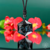 Deep healing Arfvedsonite pendant necklace by Conscious Items, featuring a polished stone pendant on a silver chain.