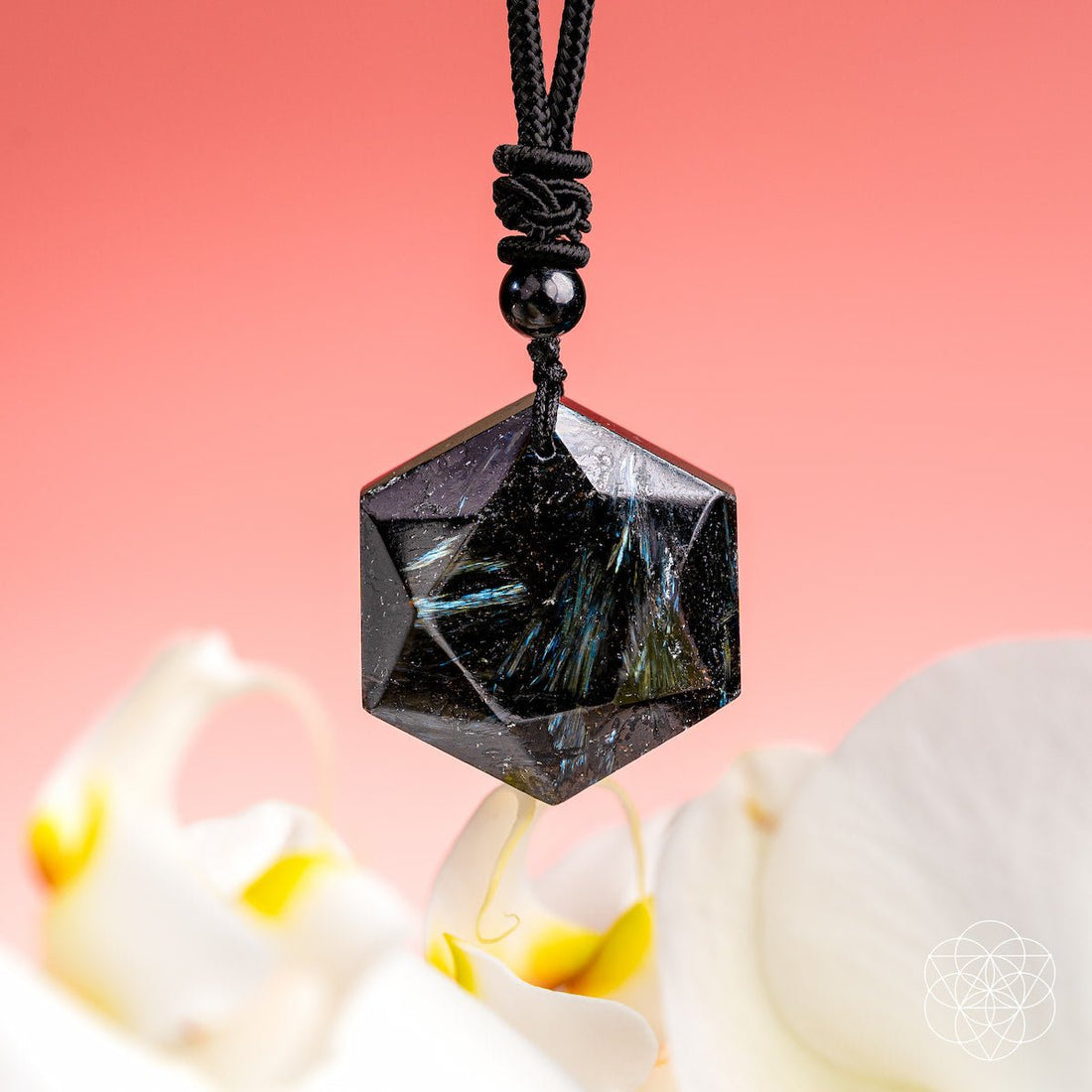 Deep healing Arfvedsonite pendant on a necklace from Conscious Items, featuring a polished stone with intricate natural patterns.