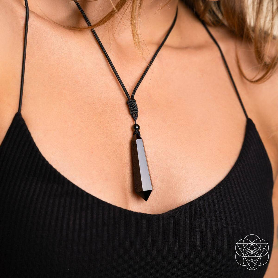 Black Obsidian Talisman pendant necklace by Conscious Items featuring a protective black obsidian stone on a cord.